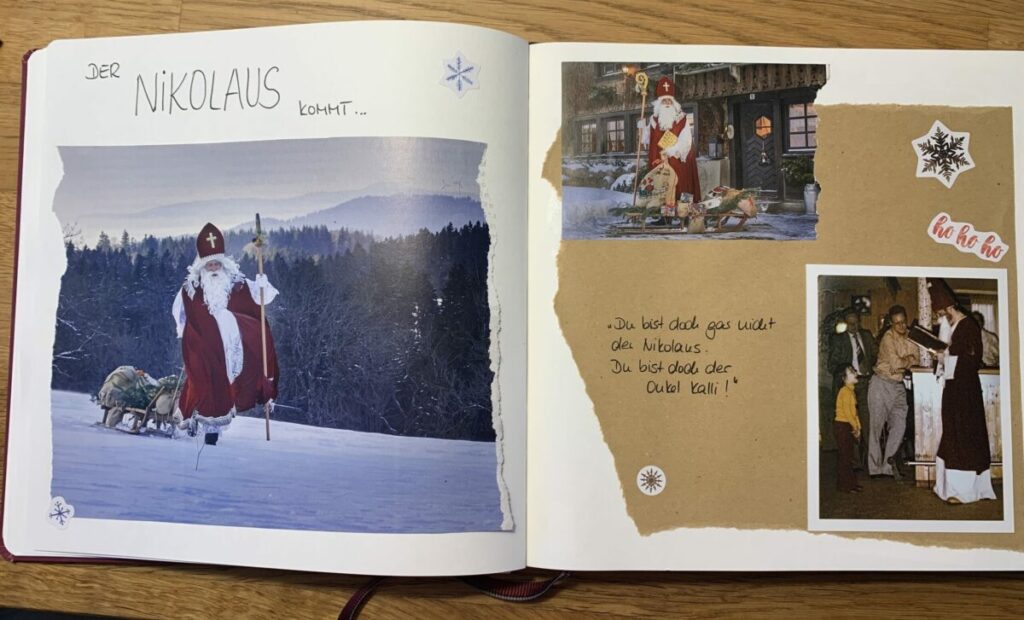 Doppelseite aus meinem persönlichen Weihnachtsbuch: Zeitungsausschnitte mit Bildern vom Nikolaus, wie er mit seinem Schlitten durch den Schnee stapft. Dazu ein Foto von mir als Kind vor dem Nikolaus und einem handgeschriebenen Text daneben: "Du bist doch gar nicht der Nikolaus. Du bist doch der Onkel Kalli!"